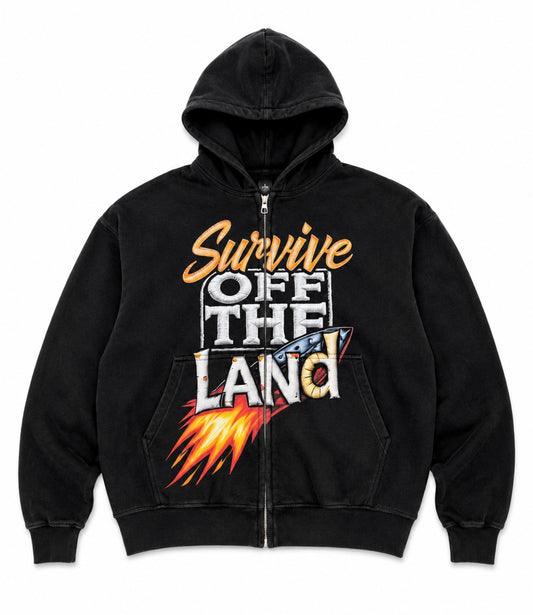 A black zip-up hoodie with a front graphic that reads 'Survive Off The Land' in orange, white, and blue, with a flame design below, shown on a plain white background.