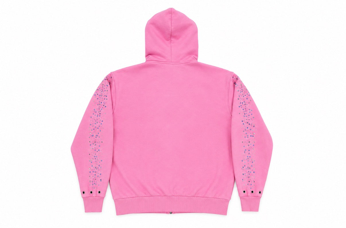 A pink zip-up hoodie shown from the back, featuring decorative vertical lines of blue and purple rhinestones running down both sleeves.